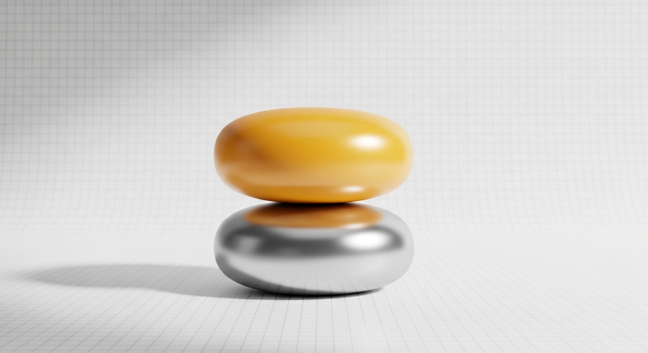 Two stacked rounded blocks, one yellow and one silver, on a subtle grid.