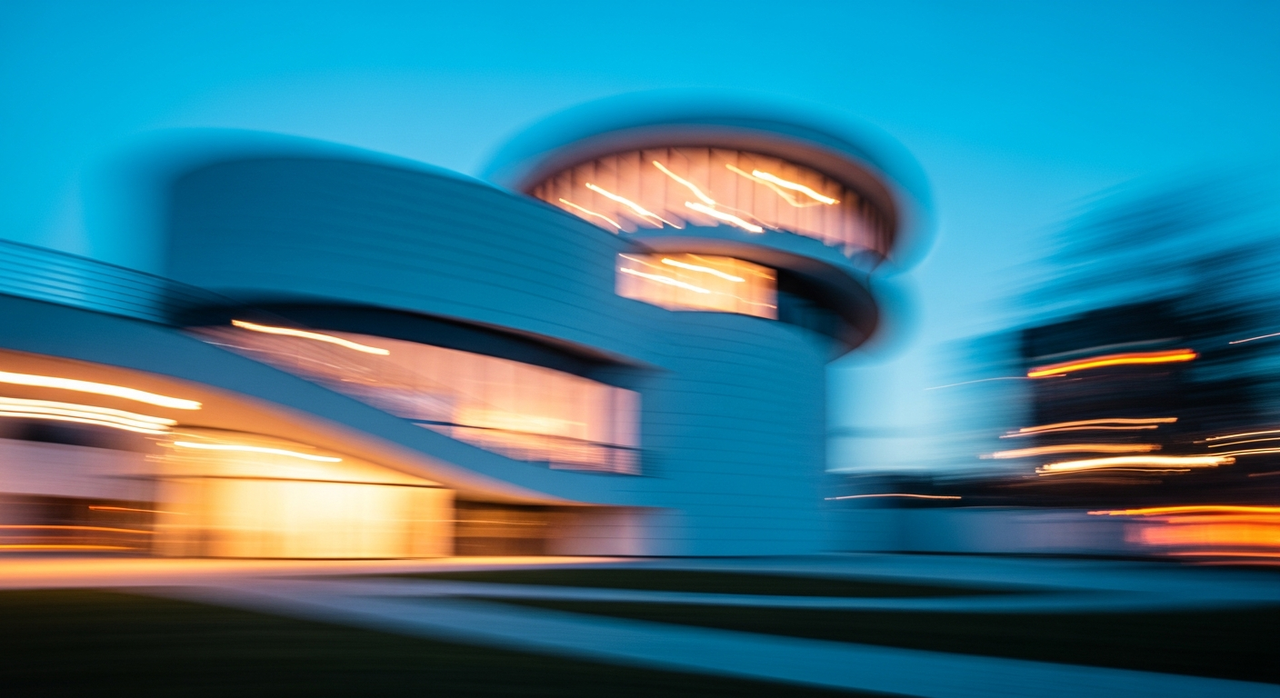 A modernist building's curved facade, rendered with soft edges against a blurred environment.